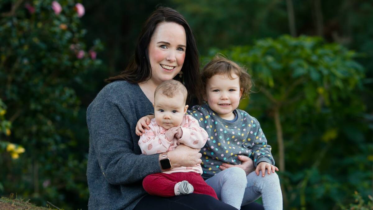 Illawarra Mercury journalist Kate McIlwain with daughters Winona, who was born in February, and Hadley, 2. Picture: Anna Warr