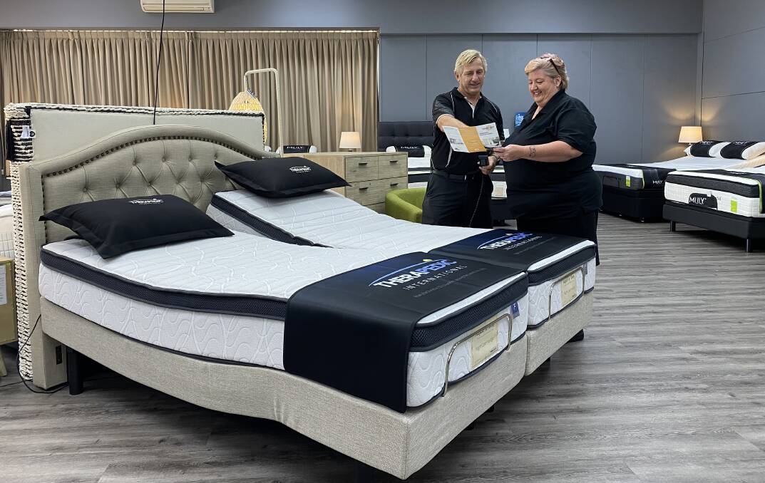 Your perfect bed: Ian Millington helps a customer at the Adjustacare showroom in Warners Bay where you'll find one of Newcastle's largest range of adjustable beds as well as lift chairs.