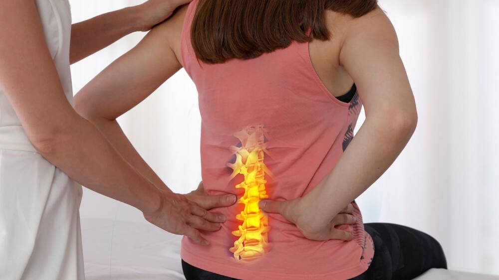 Continuous back pain is one of the problems faced by women with large breasts. Image: Shutterstock