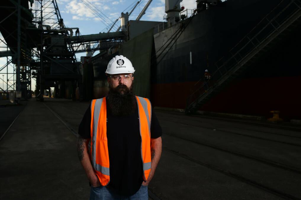 GrainCorp's Port Operations Manager, Jade Mann, with a ship being loaded at the company's Carrington terminal. Picture: Jonathan Carroll