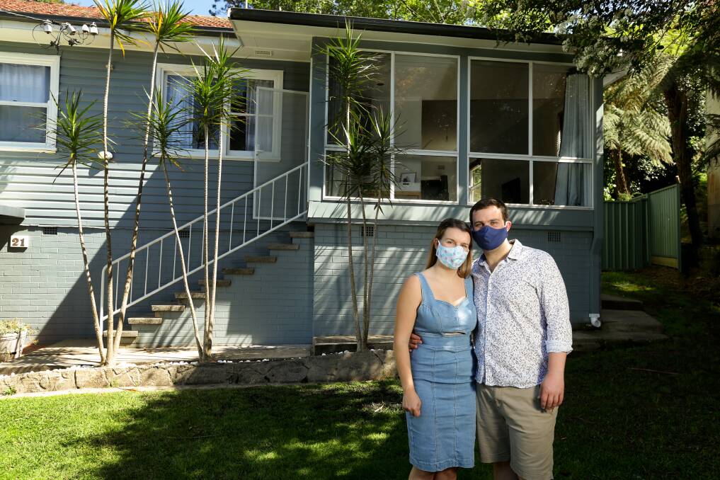 Rachel Tutill and Stephen Johnston outside their home. Picture: Jonathan Carroll