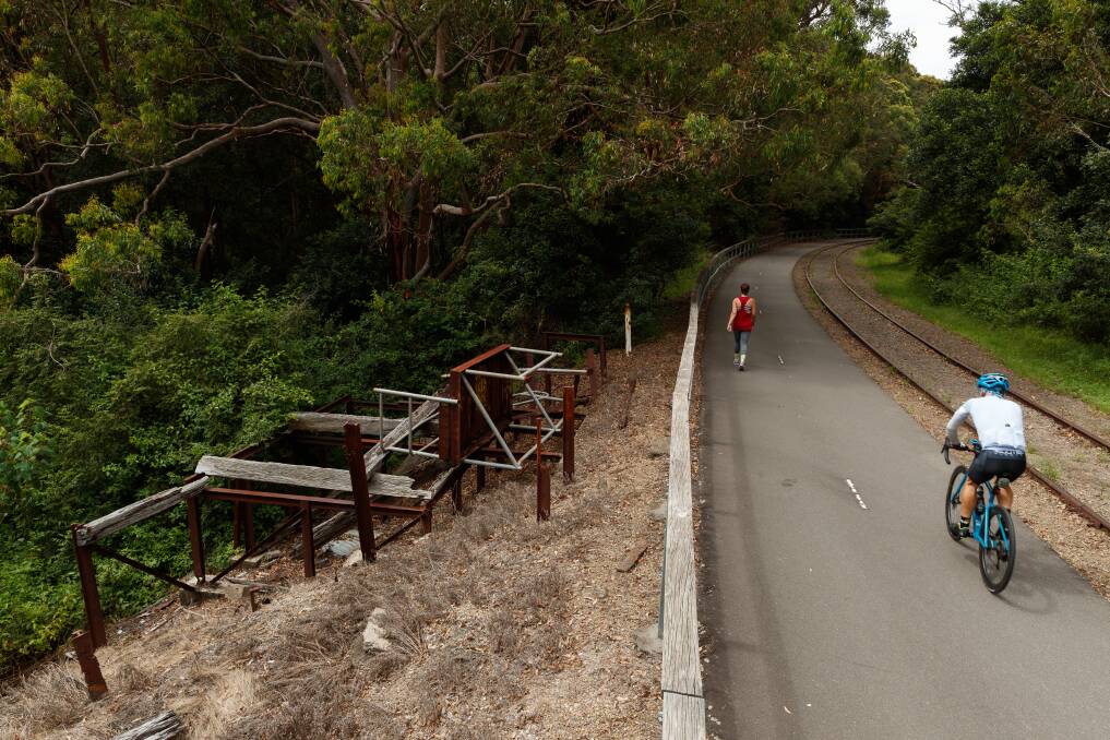 A cyclist passes the ruins of the signal box at Fernleigh Loop. Picture: Max Mason-Hubers