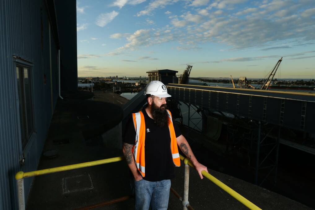 GrainCorp's Port Operations Manager, Jade Mann, watches the loading of a ship at the company's Carrington terminal. Picture: Jonathan Carroll