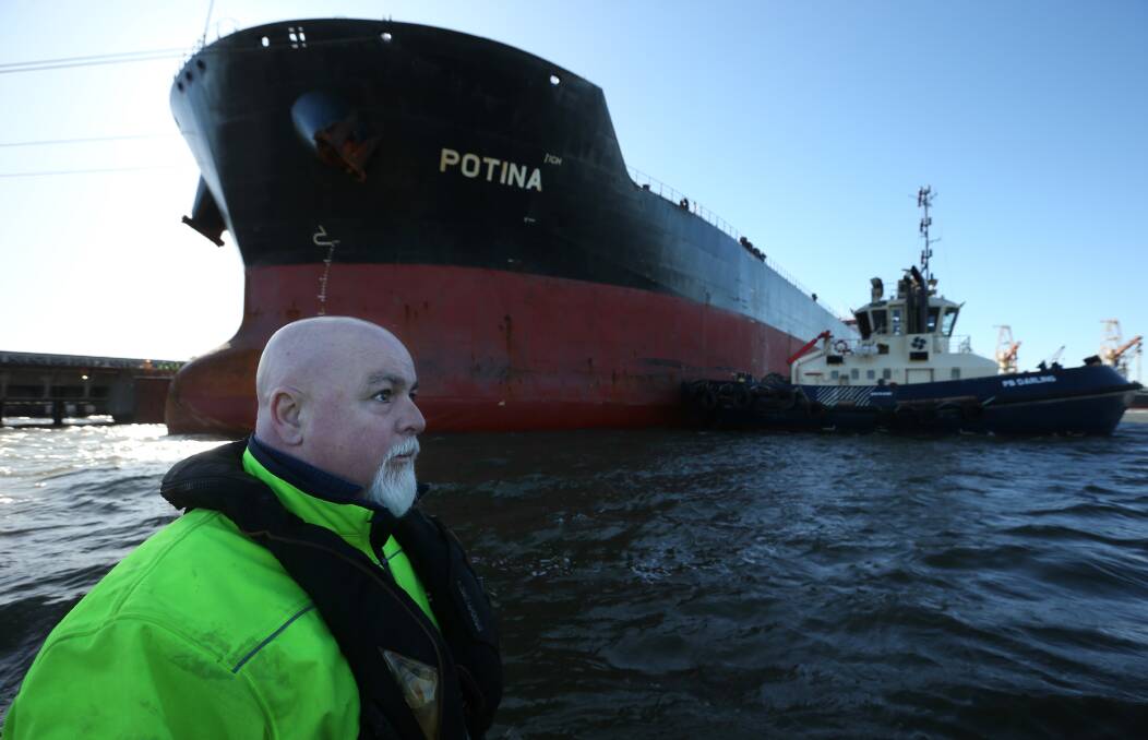 Veteran linesman Jason Gough watches on, as the bulk carrier "Potina" is tied up. Picture: Simone De Peak