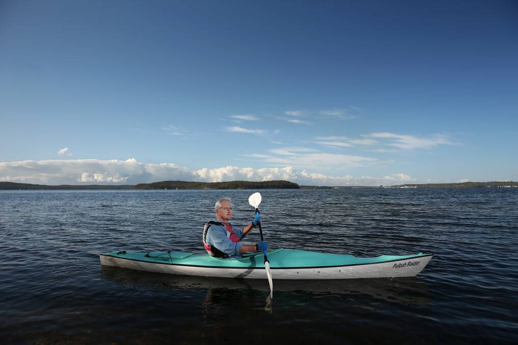 Scott Bevan kayaking on Lake Macquarie. Picture: Simone De Peak