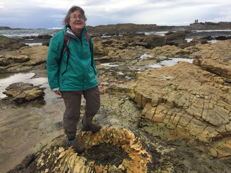 DISCOVERY: Roz Kerr with a petrified tree stump, estimated to be more than 250 million years old. 