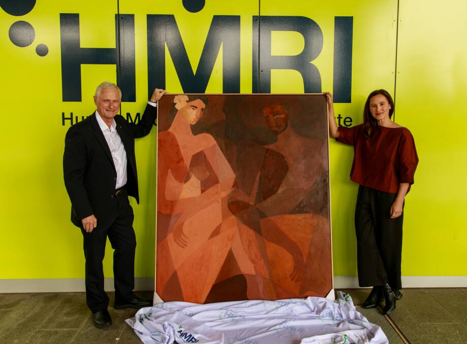 HMRI's 2020 Researcher of the Year, Professor Nick Talley, and artist Brittany Ferns with the painting, 'Conversation', which was inspired by the researcher's work. Picture: Courtesy, HMRI 