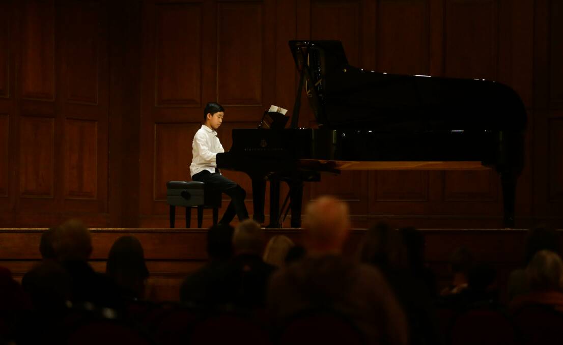 Markus Lim, aged 12, performing at the lunchtime concert at City Hall. Picture: Jonathan Carroll