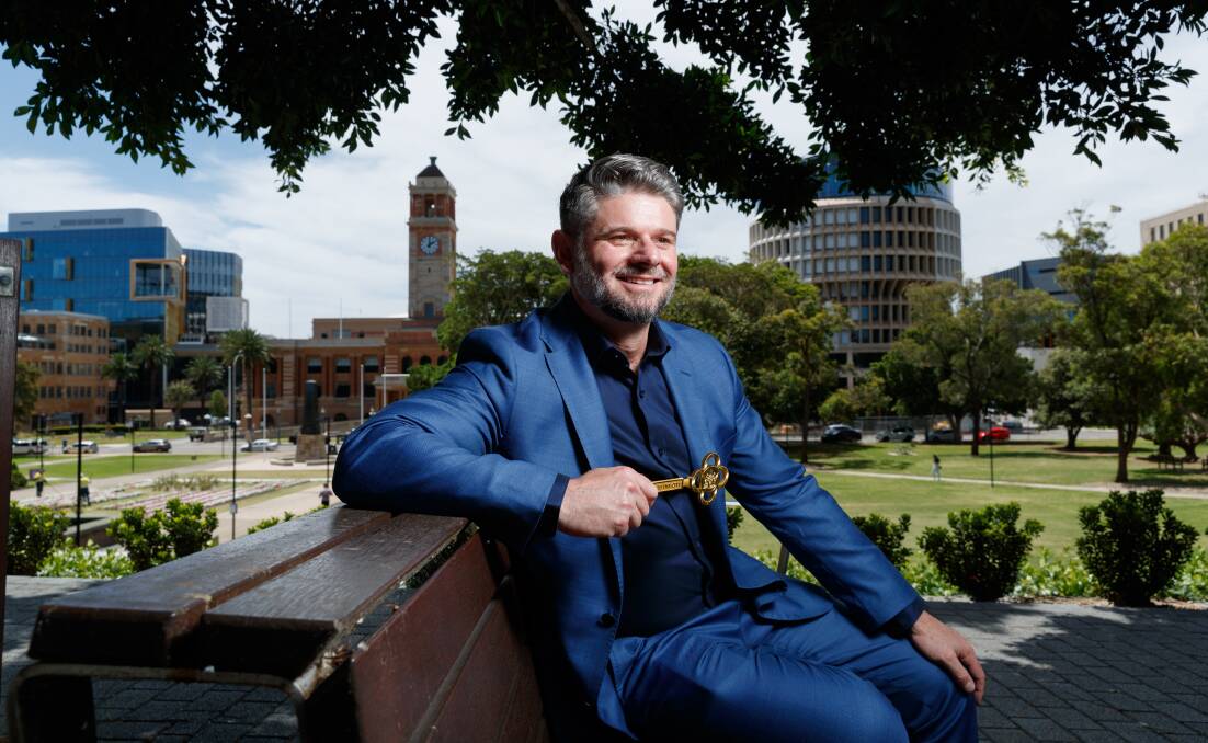 AMBASSADOR: Hunter Valley boy and director of the National Gallery of Australia Nick Mitzevich holds the key to the city outside Newcastle Art Gallery. Picture: Max Mason-Hubers