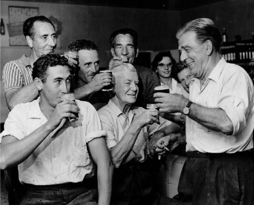 William Dobell having a drink with fellow locals at Hotel Wangi. 