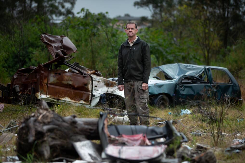 RID investigator Peter White at an illegal dumping site in Tenambit. Picture: Marina Neil