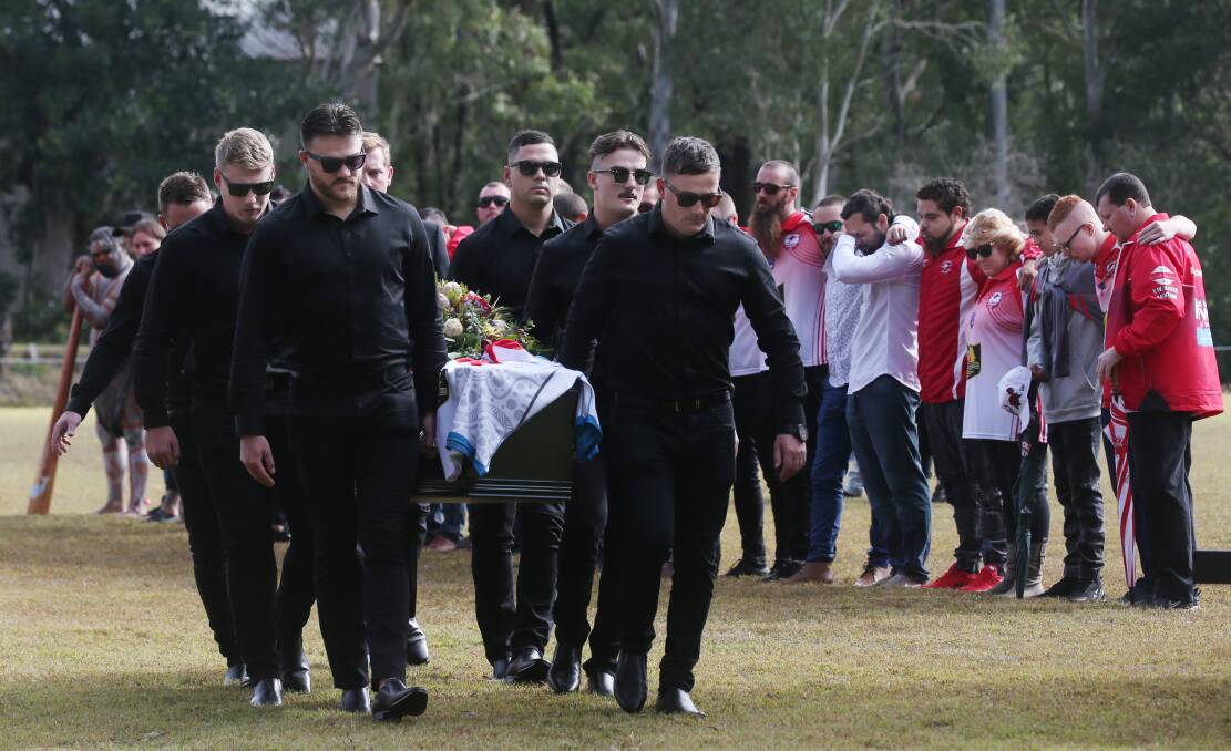 Karuah Roos players and officials form a guard of honour at the funeral service of team mate and friend Ben Langdon. Picture: Simone De Peak