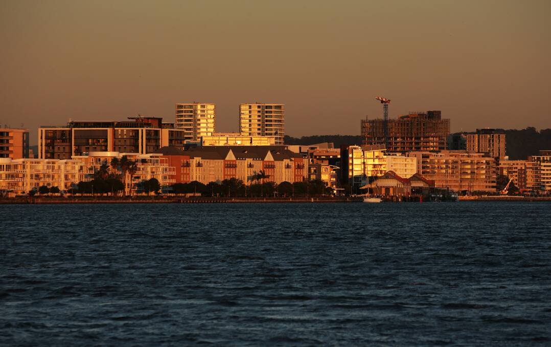 The residential and commercial buildings along the harbour at Honeysuckle at dawn. Picture: Simone De Peak 