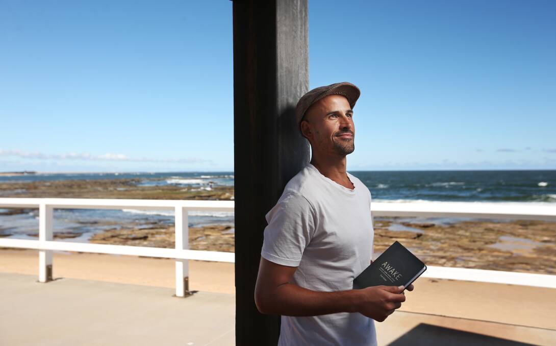 WIDE AWAKE: Author and happiness coach Evan Sutter near one of the places he loves, the sea. Pictures: Simone De Peak 