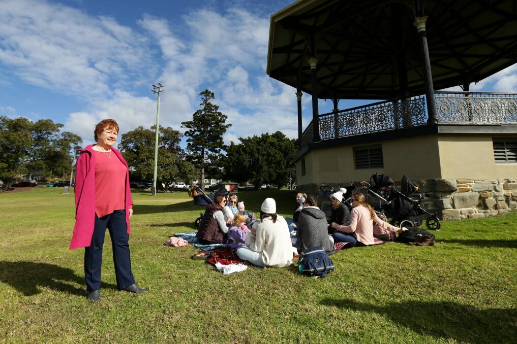 THEN AND NOW: Historian and author Julie Keating, with a mothers' group, at the rotunda in Lambton Park. Picture: Jonathan Carroll 