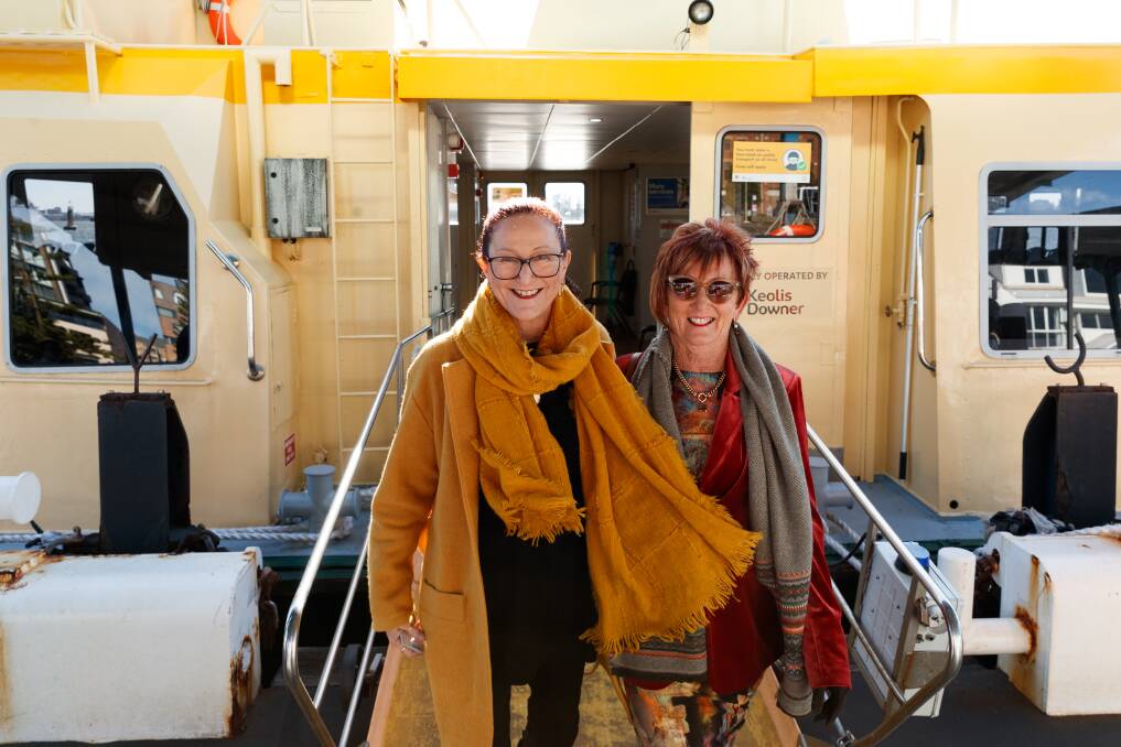 Ferry passengers Mandy Tobin, of Stockton, and Cheryl Collins, of Fern Bay, disembark at Newcastle. Picture by Max Mason-Hubers