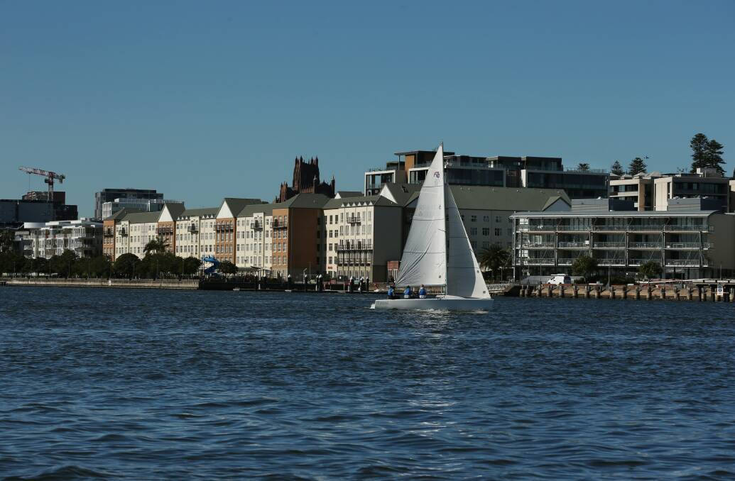 Sailing on the harbour, with the city of Newcastle in the background. Picture: Simone De Peak