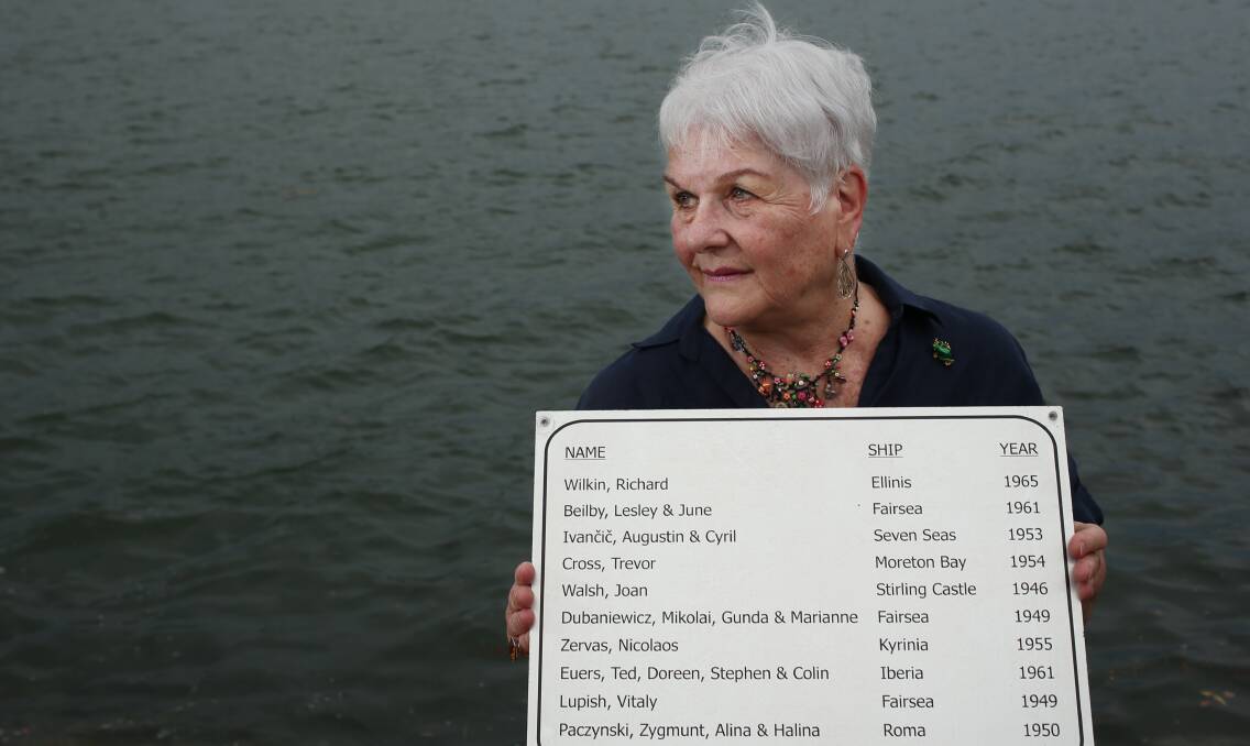 ETCHED MEMORY: Halina Paczynski holds the commemorative plaque with her family's name on it. 