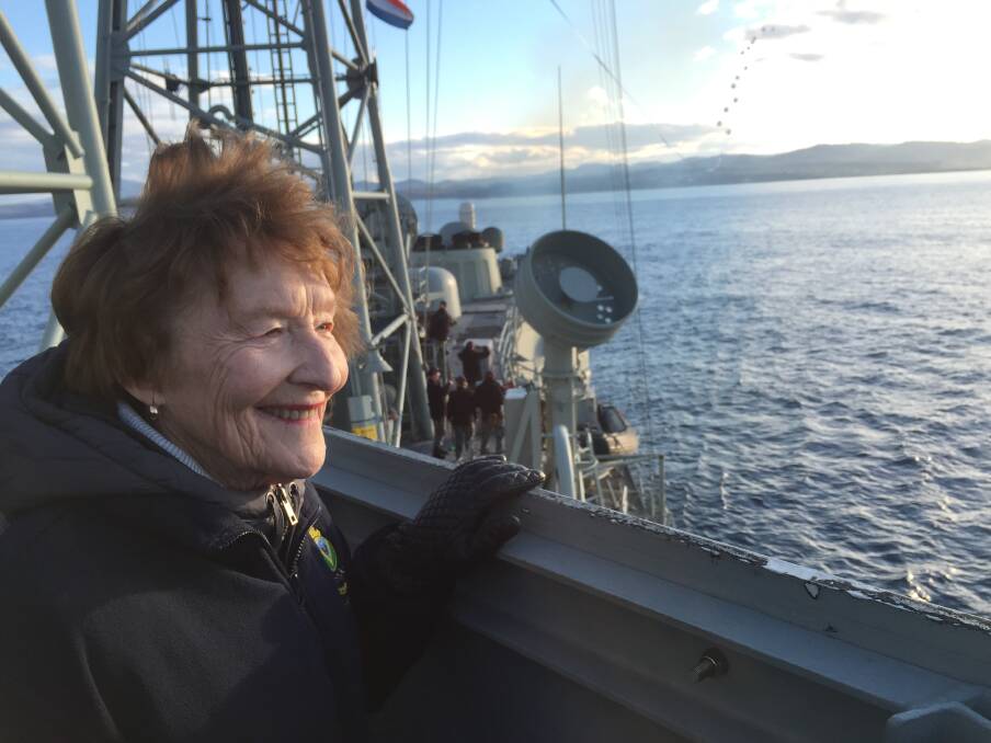 Margaret McNaughton on the deck of HMAS Newcastle as it departs Twofold Bay. Picture: Scott Bevan