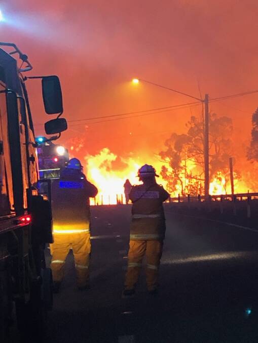 INTENSE: Firefighters confront the blaze. Picture: Courtesy, Wallarah Rural Fire Brigade