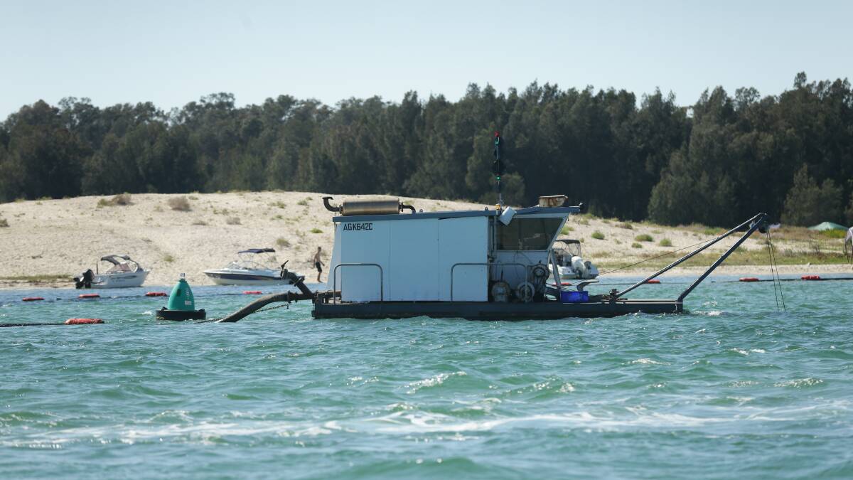 TIMELY: A dredge working in Swansea Channel near the southern entrance to Swan Bay. Picture: Jonathan Carroll
