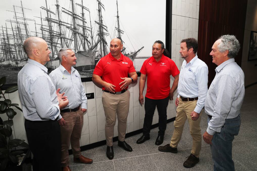 HELP FLOWS: Sione Finefeuiaki, centre, talks with Dean Taylor, Chris Conway, John Fonua, Tony Rhodes and Chris Conway about the mission to Tonga for the water improvement project. Pictures: Peter Lorimer