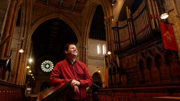 MOVING ON: Peter Guy in Christ Church Cathedral, with the organ pipes in the background that he has filled with musical sounds for almost 15 years. Pictures; Max Mason-Hubers