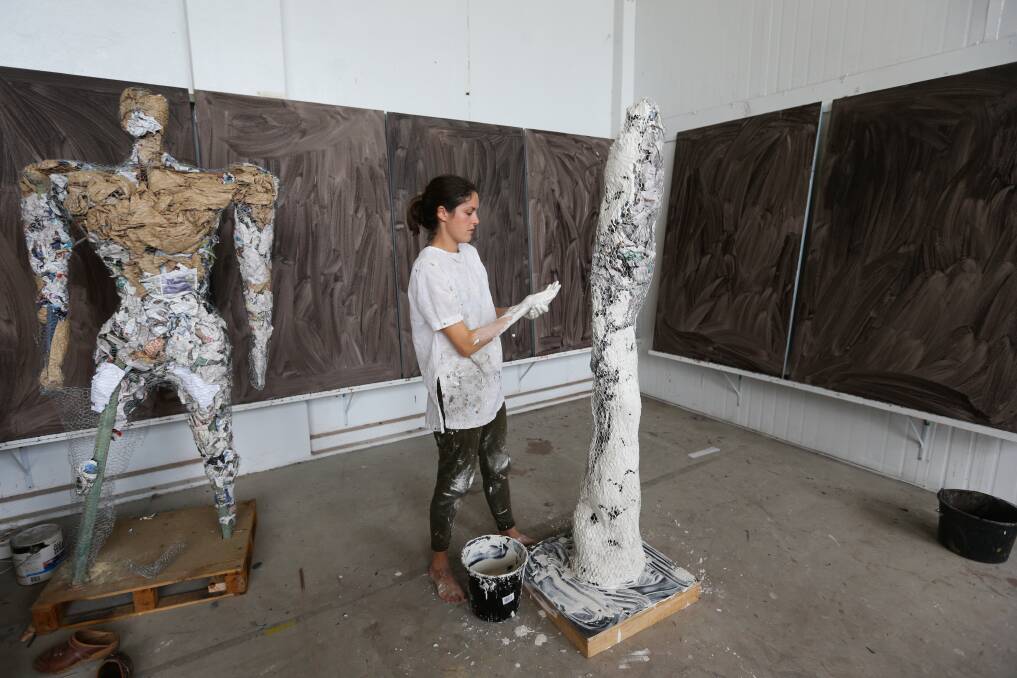 HARD WORK: Lottie Consalvo working on the sculpture in the studio.  