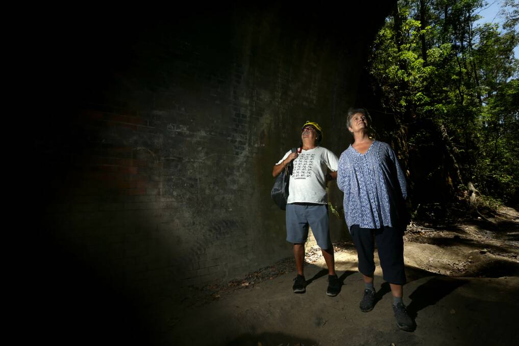 TUNNEL VISION: Billy Metcalfe and Leigh Gibbens inspect the historic No.1 Tunnel on the former Richmond Vale Railway. Picture: Jonathan Carroll