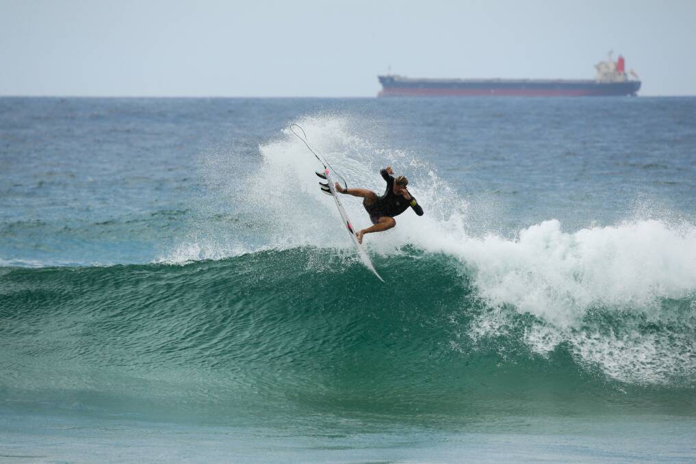 A surfer off Redhead Beach, which is in the seat of Shortland. Picture: Jonathan Carroll 