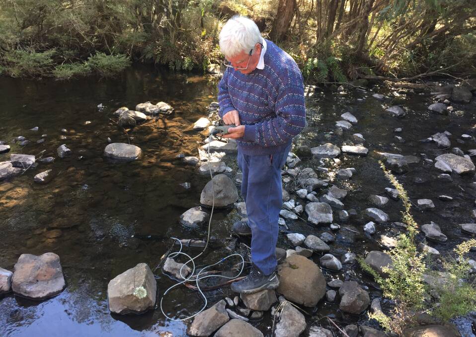 Charles Atkin monitors the water temperature, pH and dissolved oxygen levels. Picture: Scott Bevan 