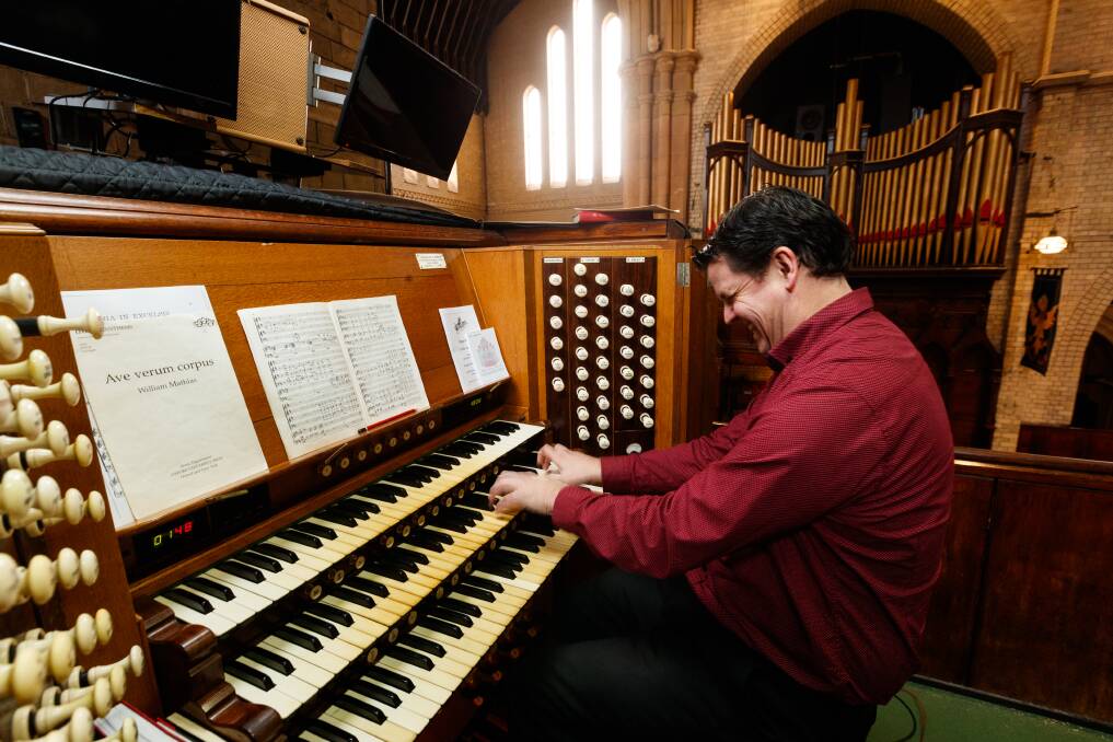 Peter Guy playing the historic organ in Christ Church Cathedral. Picture: Max Mason-Hubers 