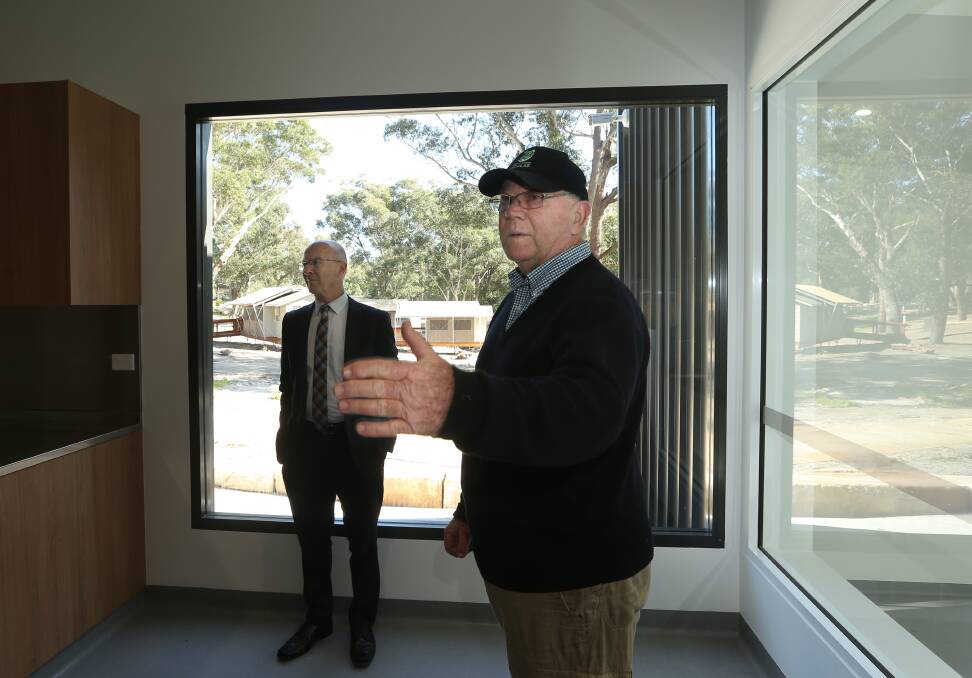 Ron Land and Port Stephens Koala Sanctuary marketing and promotions manager James Cook in the new clinic area, with the public viewing window. Picture: Simone De Peak 