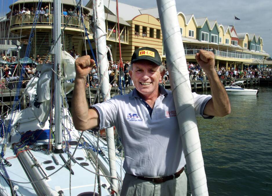 TRIUMPHANT: Tony Mowbray, on board his beloved Solo Globe Challenger, being welcomed back to Newcastle by large crowds in April 2001, after his round-the-world voyage. Picture: Ron Bell