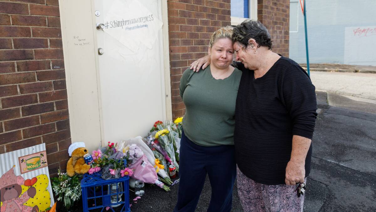 GRIEVING: Bernie Sessions' sister Jenny Allen and mother Pauline Sessions outside the doorway, which is fast becoming a shrine to their loved one. Picture: Max Mason-Hubers