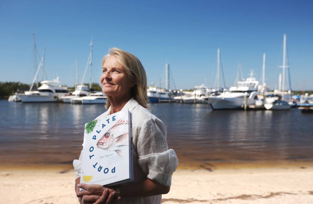 PASSION PROJECT: Author Lynda Sloan holds a copy of "Port to Plate", the book she helped bring to publication. 
