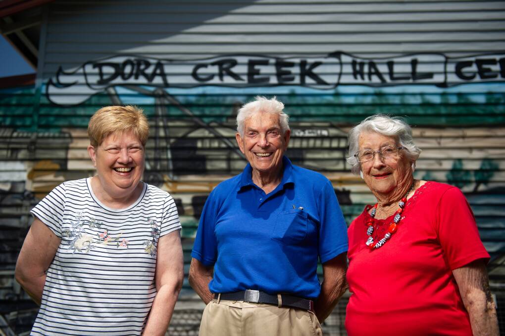 Cathie Robison, Bill Johnson and Doris "Dot" Brittliff outside the Dora Creek hall. Picture: Marina Neil