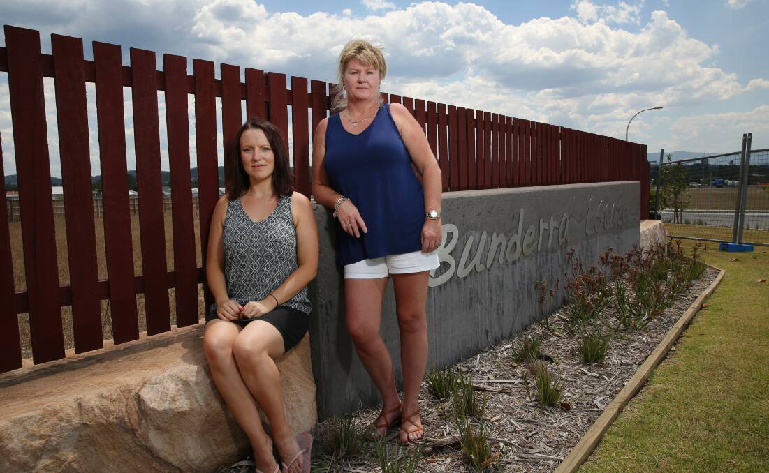 PLANS: Alex Whitall (left) and Nicole Griffin, outside Bunderra Estate in December, are hopeful they can soon begin building on their blocks.   