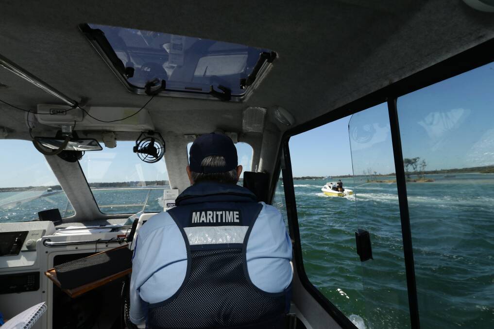 PATROL: NSW Maritime boating safety officer Peter Browne near the Sand Islands and Swansea Channel. 