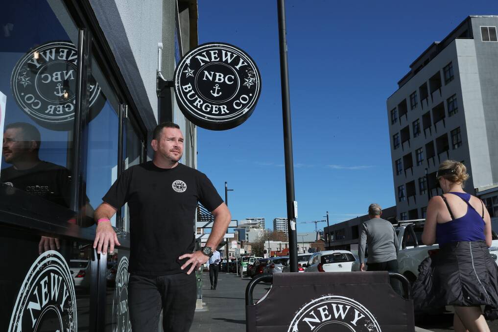 Ben Neil, from Newy Burger Co, outside his Hunter Street restaurant. Picture: Peter Lorimer