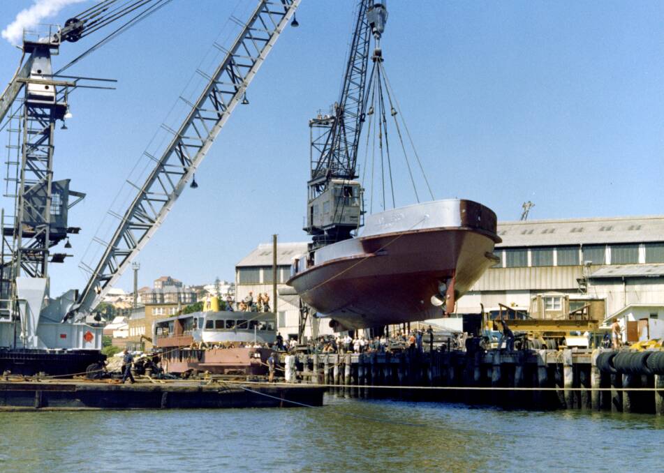 LAUNCH: 'Lady Herron' is lowered into Newcastle harbour in 1979. Picture: Courtesy, Bill Allen