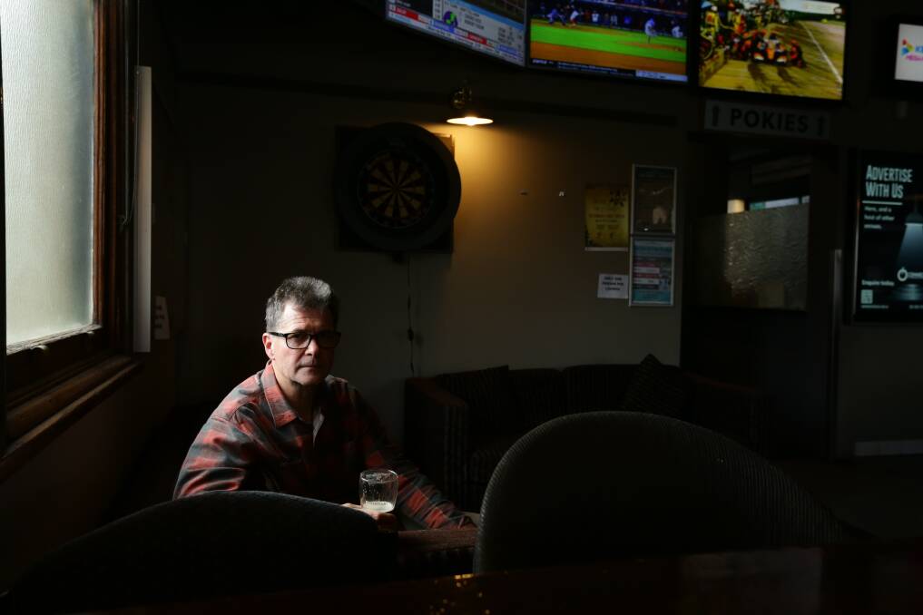 John Hughes in the corner of the bar where his grandfather played accordion. Picture: Jonathan Carroll