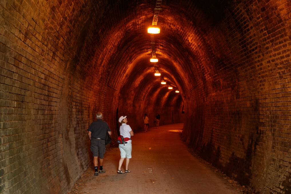 Rail historian Ed Tonks and Sydney visitor Deborah Goodman inspect the tunnel. Picture: Max Mason-Hubers 