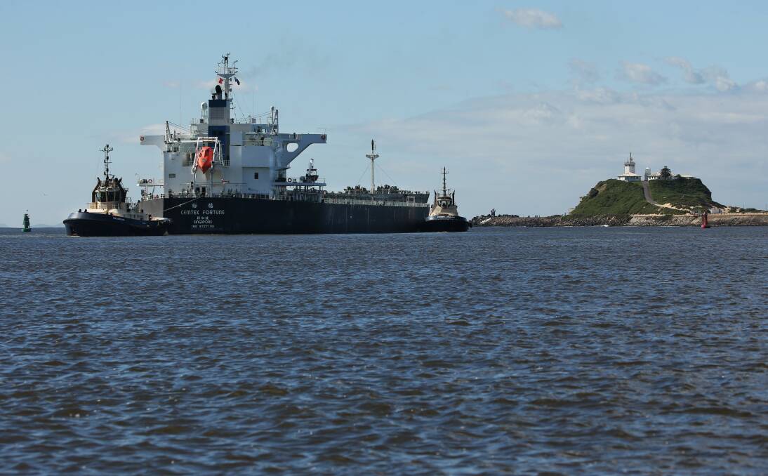 A ship departs Newcastle, heading for the open sea. Picture by Simone De Peak