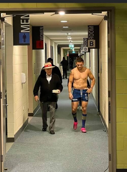 Indigenous leader Uncle Bill Smith walks with his grandson, Parramatta Eels player, Will Smith at McDonald Jones Stadium in Newcastle earlier this season. Picture: Courtesy, the Smith family 