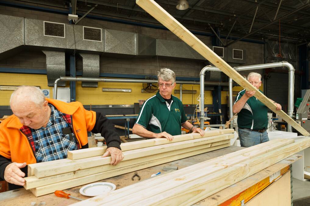 TEAM: Newcastle Men's Shed members Don Bailey, Neville Pollock and Bernard Flynn at work on a project. 