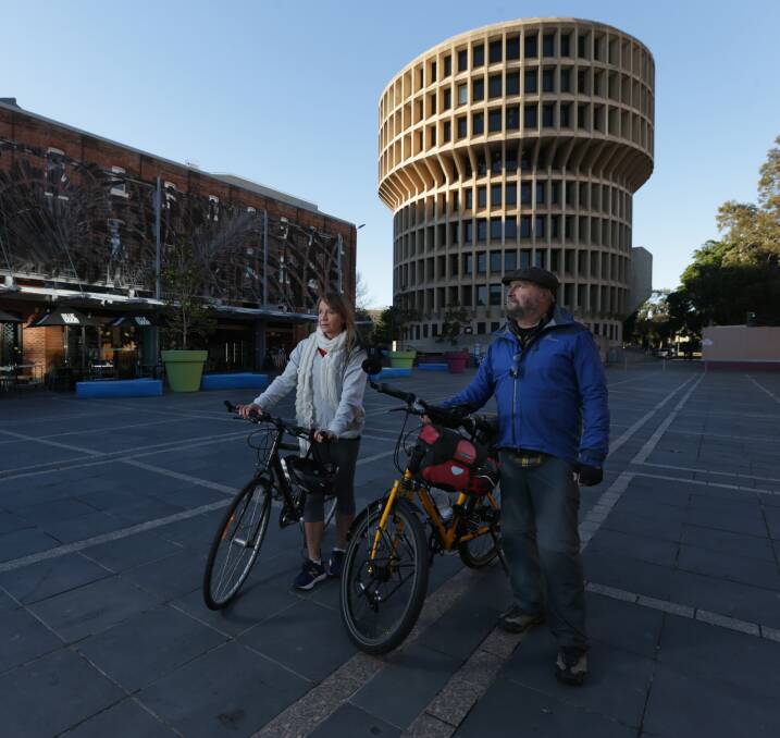 CONCERNED: Cyclists Deborah Moore and Sam Reich, with Newcastle council's administration building in the background. Picture: Simone De Peak 