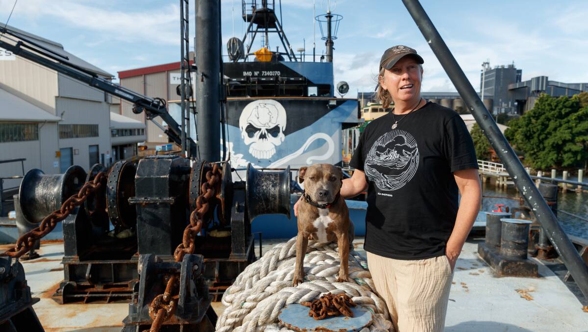 Kerrie Goodall and her dog, Admiral, on the retired Sea Shepherd flagship, the "Steve Irwin", at Thales' wharf at Carrington. Picture: Max Mason-Hubers