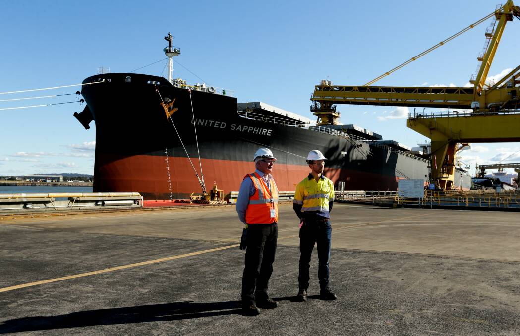 Trevor Simmons and Andrew Dobbie at the Port Waratah Coal Services terminal on Kooragang Island. Picture: Jonathan Carroll