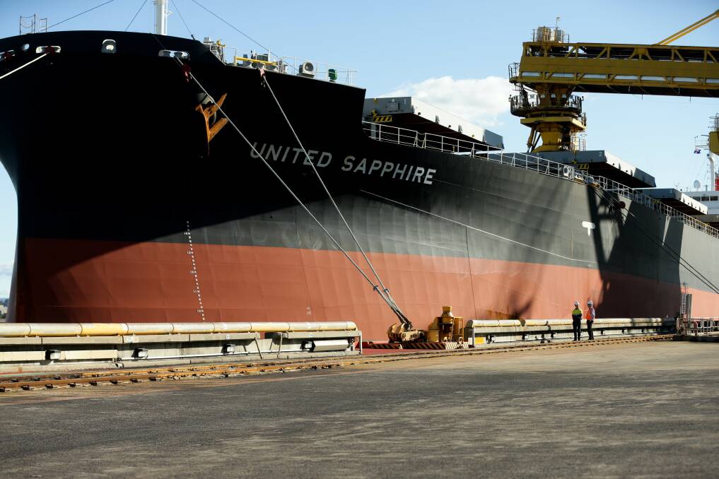A ship being loaded at the Port Waratah Coal Services terminal on Kooragang Island. Picture: Jonathan Carroll
